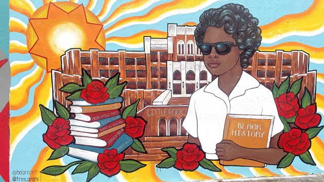A mural depicting Elizabeth Eckford in front of Central High with books bearing the names of the 9.