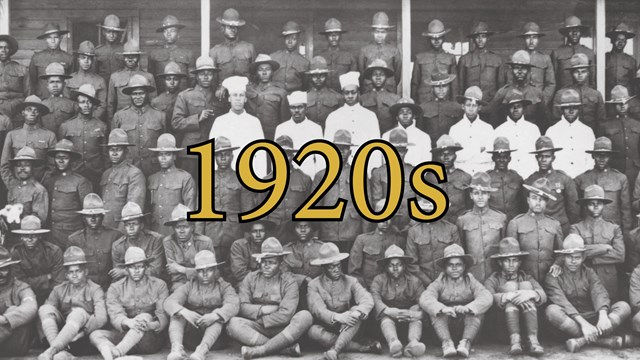 A group of Buffalo Soldiers standing in a large group in 6 rows. They are looking at the camera.