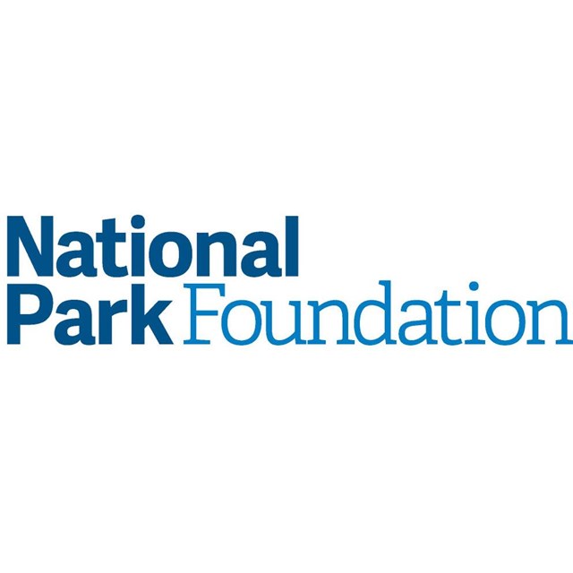 a white arrowhead in a blue square and text reading National Park Foundation