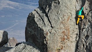 Colorful climber ascends granite pinnacle called the Anteater