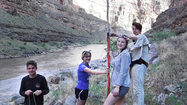 Several people standing in a canyo