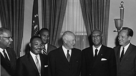 B&W photo of civil rights leaders standing next to President Eisenhower