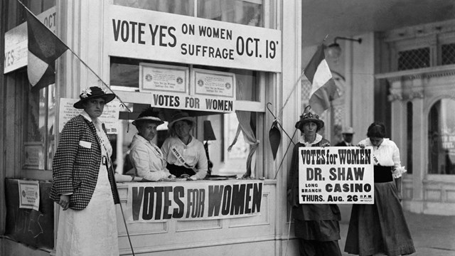 Women at a sufferage booth in 1914