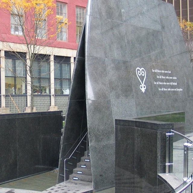 a memorial with black granite