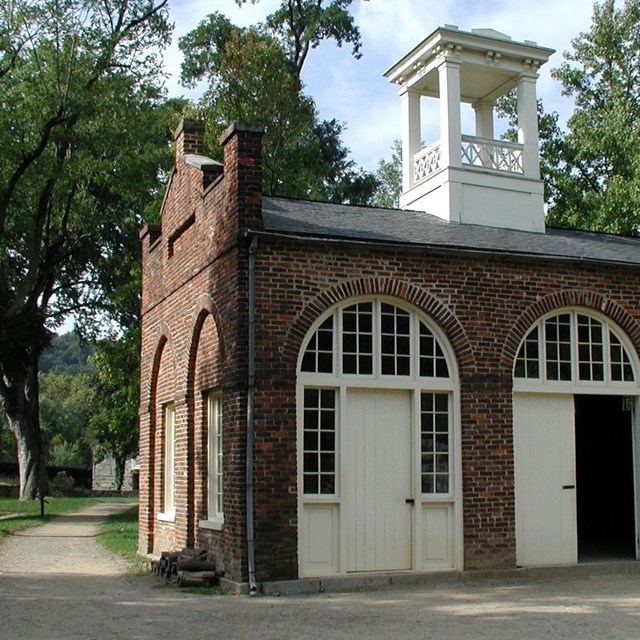 a brick building with arched doorways