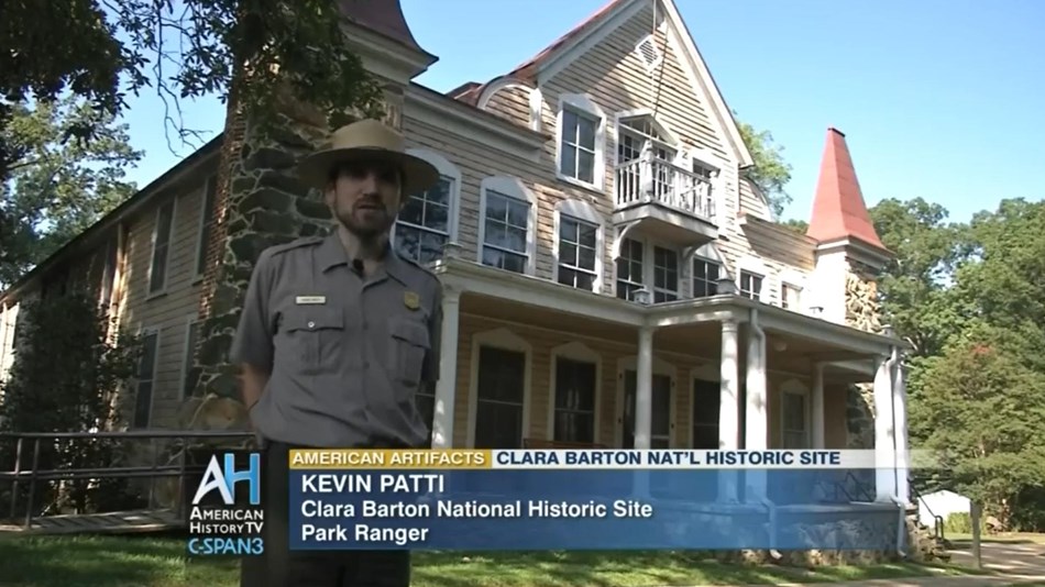 A Park Ranger in front of the Clara Barton House.