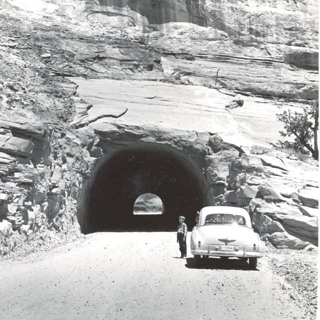A photo of a car going through a tunnel