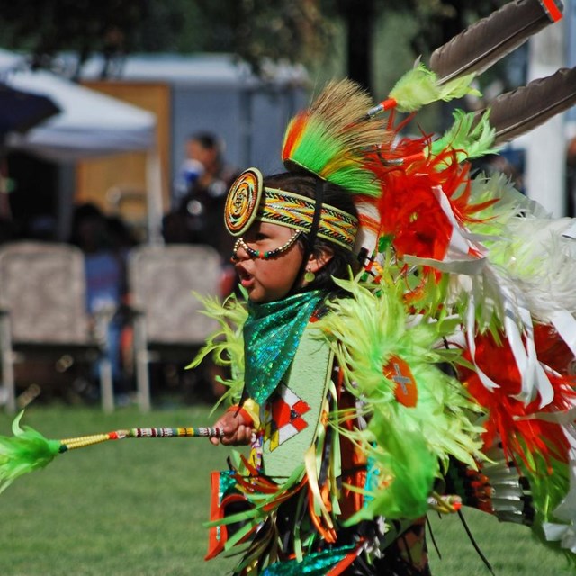 A Ute dancer in traditional clothing