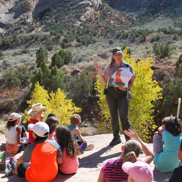 Park ranger with students on a field trip.