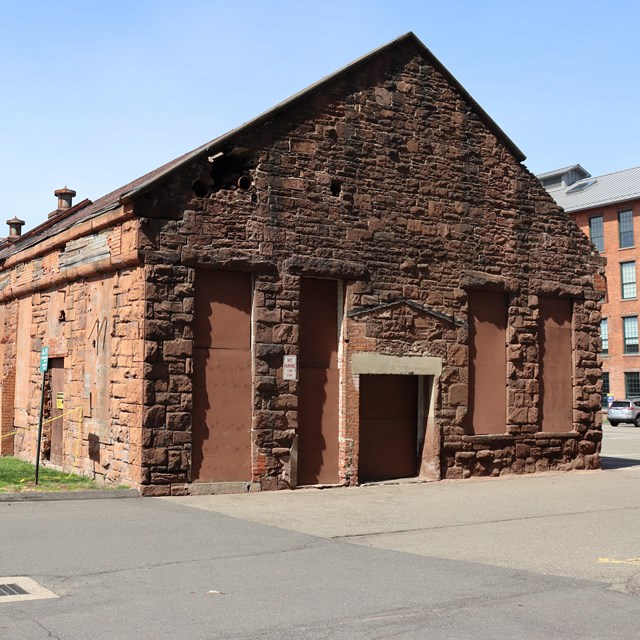 One story brick building with gable r