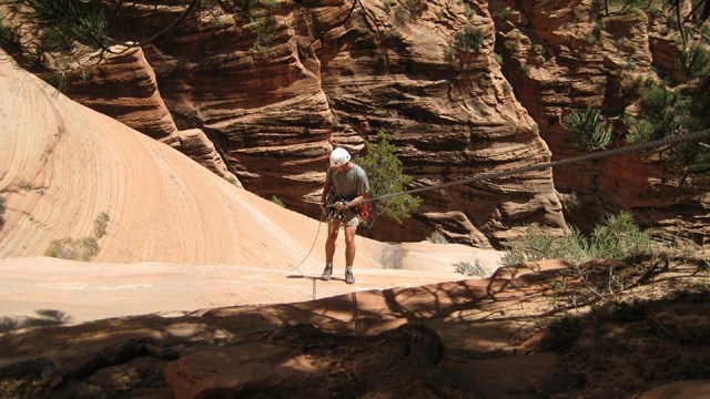 man preparing to rock climb