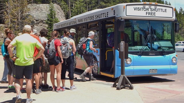 Park visitors loading the shuttle bus at Bear Lake.