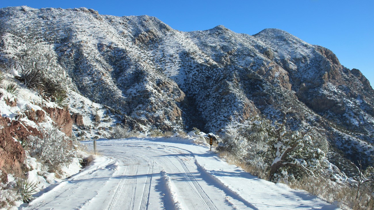 Snowy road, winding up mountain pass