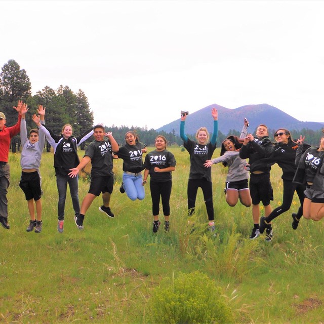 Youth Summit participants jumping out of nature excitement.