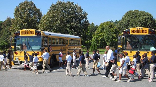 Students board a bus after visiting Cowpens National Battlefield.