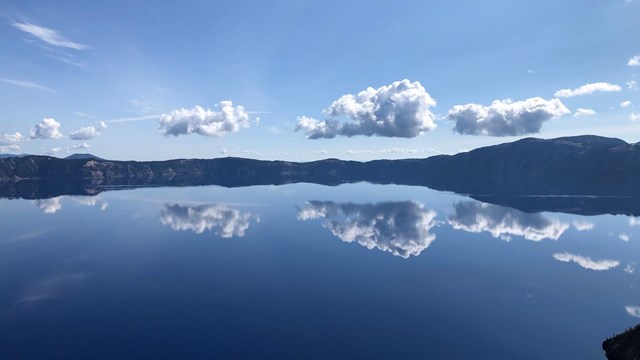 Crater Lake Blue with distand Cloud reflections