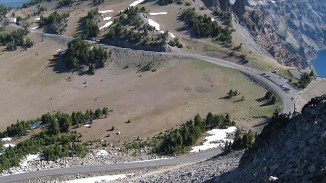 West Rim Drive with lake and landscape views