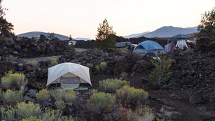 Photo of the Craters campground, with tents nestled among lava rock