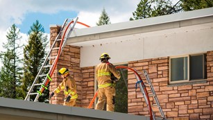 Fire fighters on a roof training