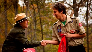 Ranger shaking hand of an Eagle Scout