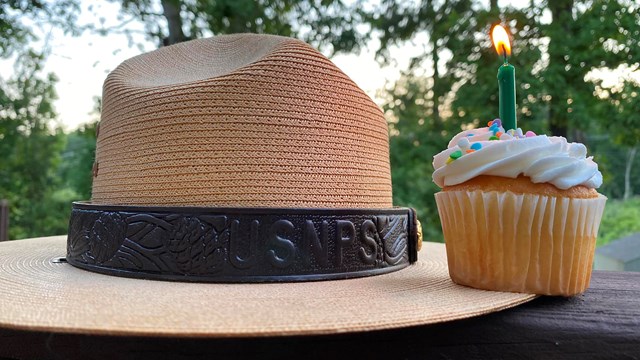 Birthday cupcake next to a ranger hat