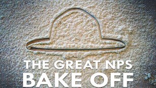 A ranger hat outline in flour with text reading "The Great NPS Bake Off"