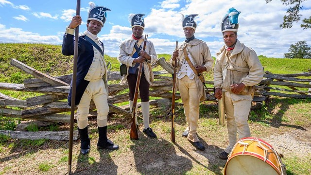 Reenactors dressed as the 1st Rhode Island Regiment in the Revolutionary War