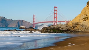 Golden Gate Bridge crossing a bay from cliff to cliff