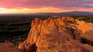Sunset over volcanic bluffs in a high desert