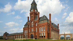 Large brick building with a clock tower
