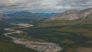 River in a valley lined with mountains