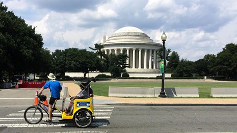 A guided pedicab tour in front of the Thomas Jefferson Memorial in Washington DC