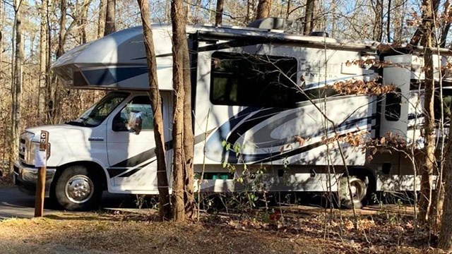 An RV in a campsite.