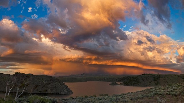 a colorful sky with storm clouds