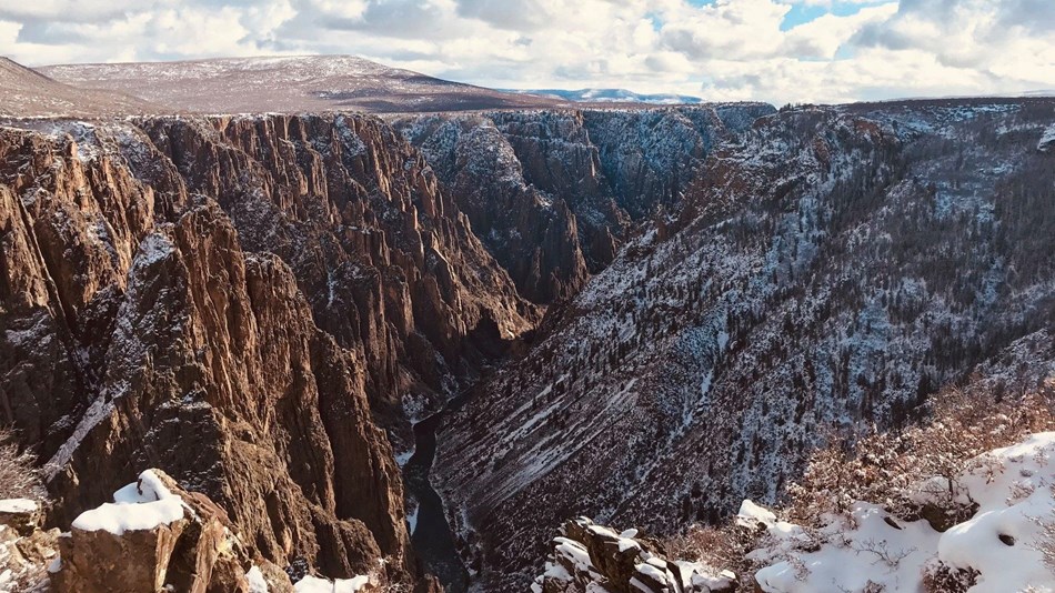 Snow covers the jagged stone spires of Black Canyon of the Gunnison National Park.