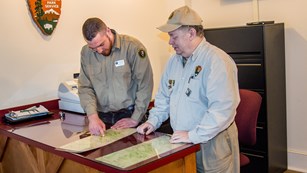 Ranger with visitors on a hike at the beaver marsh.