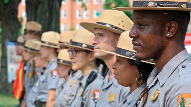 A close-up of a group of Park Rangers standing together at Fort Stevens. 