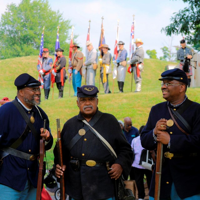 Civil War reenactors pose for group photo at Fort Stevens. 