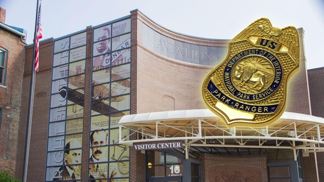 The Wright-Dunbar Interpretive Center and NPS Law Enforcement badge