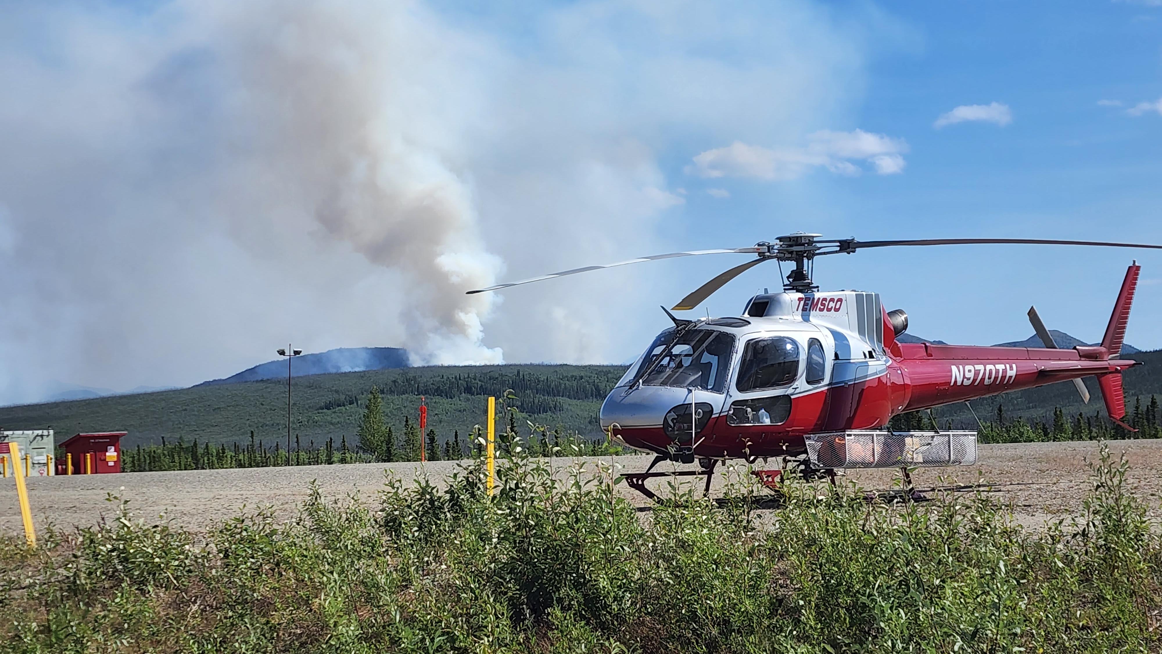 Park scientists boarding a bush plane to study fire effects in a remote area of Alaska