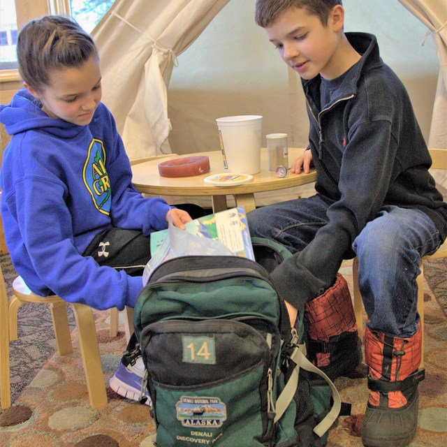 two siblings explore a discovery pack together