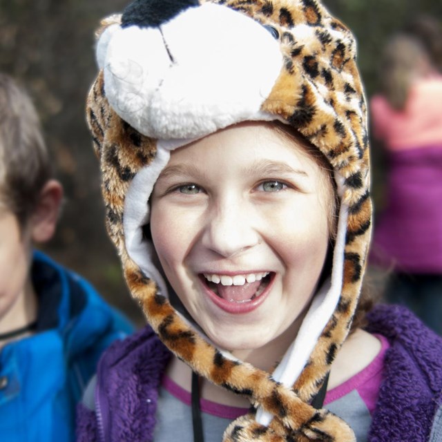 Children smile while hiking