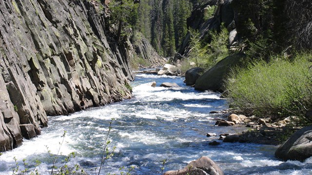 The San Joaquin River flows through a rocky narrow.