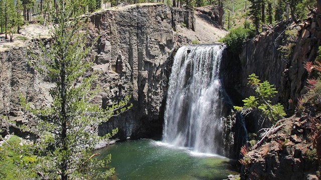 The San Joaquin rivers flows over a cliff, forming Rainbow Falls.