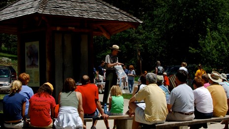 A park ranger presenting to a group of visitors