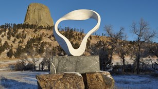 The Peace Sculpture with Devils Tower in the Distance