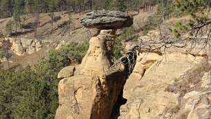 A hoodoo - a pillar of softer rock capped by a harder substance