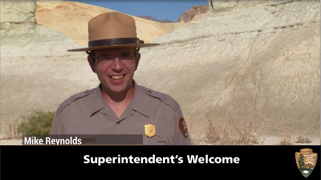 A man in uniform in a desert environment
