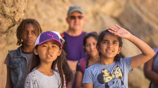 Students standing in a canyon.