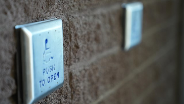 Close up of Furnace Creek Visitor Center's wheelchair accessible door opening buttons